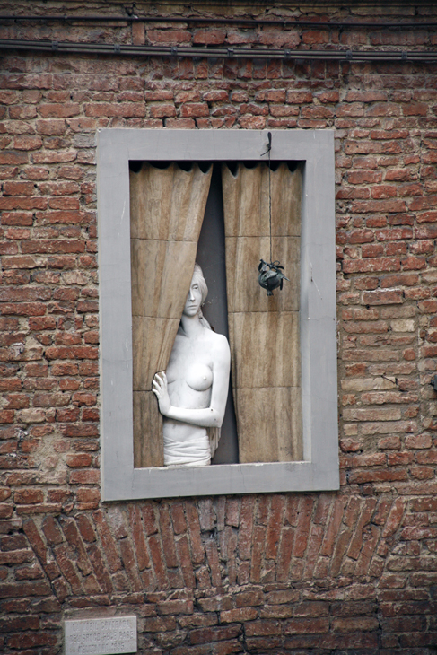 nude in window, Siena, Italy